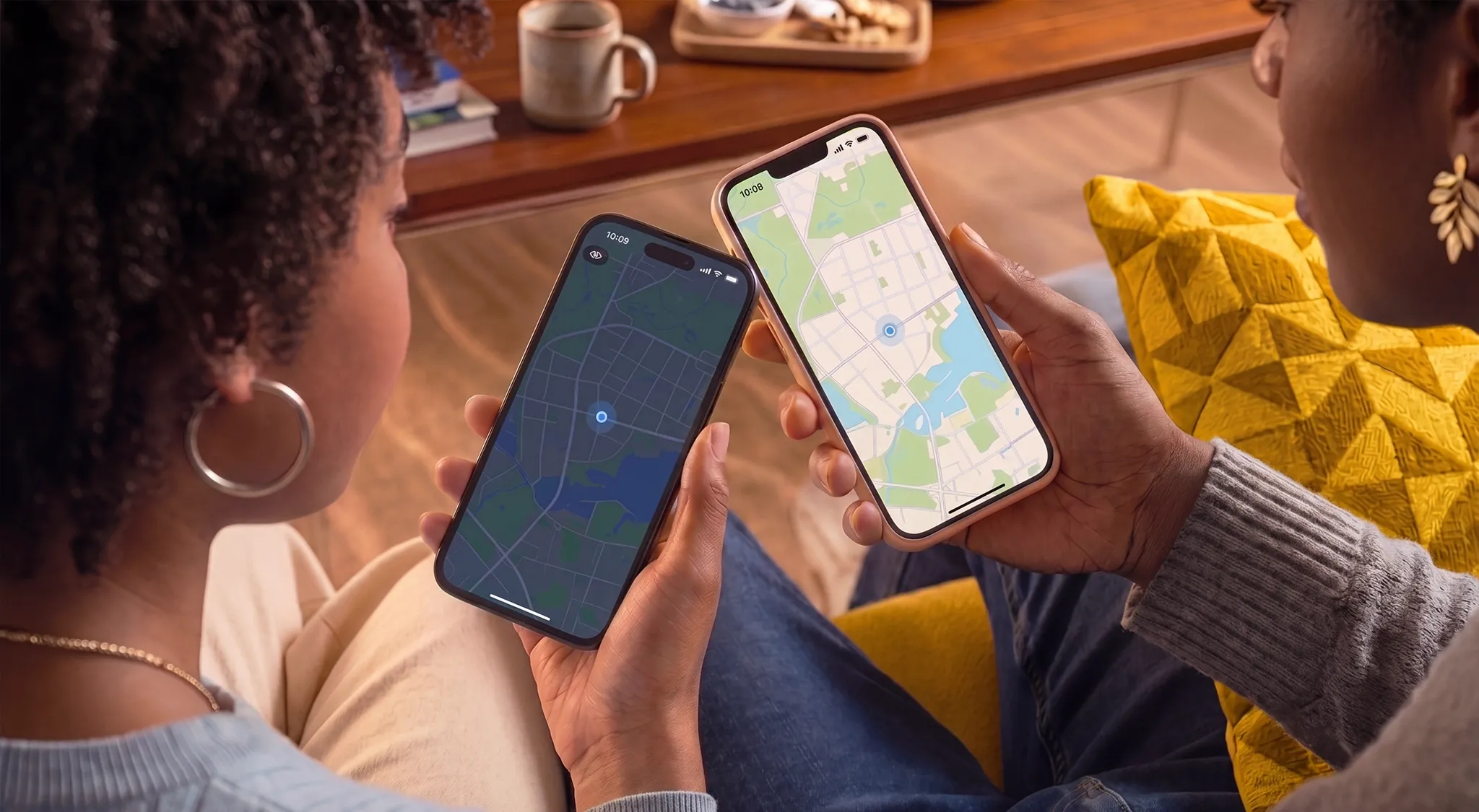 Two women looking at maps on each other's cell phones